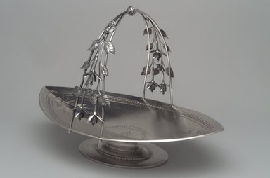 Whiting Manufacturing Company (American, 1866-Present). <em>Cake Basket</em>, ca. 1870. Silver, 8 1/2 x 12 1/4 x 8 1/2in. (21.6 x 31.1 x 21.6cm). Brooklyn Museum, Henry L. Batterman Fund and Charles Stewart Smith Memorial Fund, 1990.202. Creative Commons-BY (Photo: Brooklyn Museum, 1990.202.jpg)