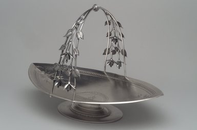 Whiting Manufacturing Company (American, 1866–Present). <em>Cake Basket</em>, ca. 1870. Silver, 8 1/2 x 12 1/4 x 8 1/2in. (21.6 x 31.1 x 21.6cm). Brooklyn Museum, Henry L. Batterman Fund and Charles Stewart Smith Memorial Fund, 1990.202. Creative Commons-BY (Photo: Brooklyn Museum, 1990.202.jpg)