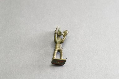 Akan. <em>Gold-weight (abrammuo): male figure</em>, 19th century. Copper alloy, length: 3 in. (length: 5.0 cm). Brooklyn Museum, Gift of Shirley B. Williams, 1990.221.24. Creative Commons-BY (Photo: Brooklyn Museum, 1990.221.24_front_PS5.jpg)