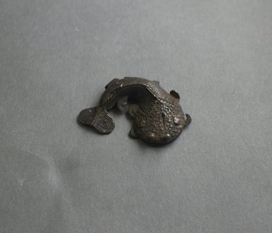 Akan. <em>Gold-weight (abrammuo): catfish</em>, ca. 1700-1900. Copper alloy, length: 3 in. (length: 5.8 cm. Brooklyn Museum, Gift of Shirley B. Williams, 1990.221.25. Creative Commons-BY (Photo: Brooklyn Museum, 1990.221.25_PS5.jpg)
