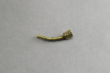 Asante. <em>Figurative Gold Weight of Side Blown Trumpet</em>, 19th century. Copper alloy, length: 3 in. (length: 4.9 cm). Brooklyn Museum, Gift of Shirley B. Williams, 1990.221.31. Creative Commons-BY (Photo: Brooklyn Museum, 1990.221.31_front_PS5.jpg)