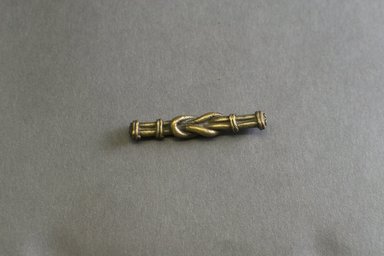 Akan. <em>Gold-weight (abrammuo): knot</em>, ca. 1700-1900. Copper alloy, length: 3 in. (length: 5.8 cm). Brooklyn Museum, Gift of Shirley B. Williams, 1990.221.41. Creative Commons-BY (Photo: Brooklyn Museum, 1990.221.41_front_PS5.jpg)