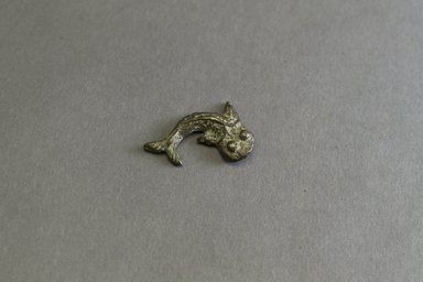 Akan. <em>Gold-weight (abrammuo): catfish</em>, 19th century. Copper alloy, length: 3 in. (length: 4.0 cm). Brooklyn Museum, Gift of Shirley B. Williams, 1990.221.52. Creative Commons-BY (Photo: Brooklyn Museum, 1990.221.52_front_PS5.jpg)