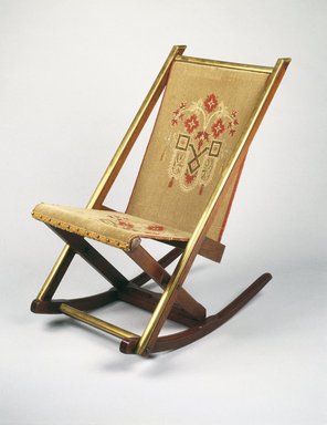 George Jacob Hunzinger (American, born Germany, 1835-1898). <em>Folding Rocking Chair</em>, ca. 1870. Walnut, brass, original upholstery, 31 3/4 x 17 7/8 x 29in. (80.6 x 45.4 x 73.7cm). Brooklyn Museum, George C. Brackett Fund, 1991.102. Creative Commons-BY (Photo: Brooklyn Museum, 1991.102_IMLS_SL2.jpg)