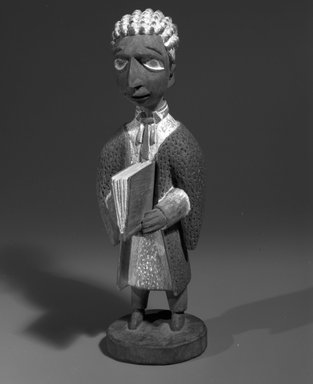 Thomas Ona Odulate (Yorùbá, Nigerian, ca. 1900-1952). <em>Figure of a Barrister</em>, first half of 20th century, ca.1940. Wood, pigment, 10 x 3 3/8 in. (25.4 x 8.5 cm). Brooklyn Museum, Caroline H. Polhemus Fund, 1991.175.1. Creative Commons-BY (Photo: Brooklyn Museum, 1991.175.1_bw.jpg)