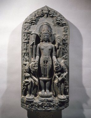  <em>Stele with Vishnu, His Consorts, His Avatars, and Other Dieties</em>, 11th century. Schist, 48 x 20 3/4 x 5 in., 192 lb. (121.9 x 52.7 x 12.7 cm, 87.09kg). Brooklyn Museum, Gift of Dr. David R. Nalin, 1991.244. Creative Commons-BY (Photo: Brooklyn Museum, 1991.244_SL1.jpg)