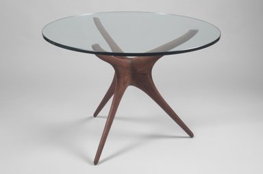 Vladimir Kagan (American, born Germany, 1927–2016). <em>Tri-symmetric Sculptured Table</em>, ca. 1953. Walnut, glass, (base): 27 9/16 x 25 1/2 x 25 1/2 in. (70 x 64.8 x 64.8 cm). Brooklyn Museum, Gift of the artist, 1991.255.1a-b. Creative Commons-BY (Photo: Brooklyn Museum, 1991.255.1a-b.jpg)