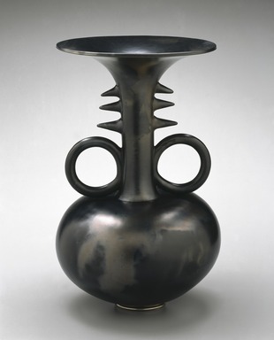 Magdalene Anyango N. Odundo (British, born Kenya 1950). <em>Symmetrical Reduced Black Narrow-Necked Tall Piece</em>, 1990. Terracotta, 16 x 10 x 10 in. (40.6 x 25.4 x 25.4 cm). Brooklyn Museum, Purchased with funds given by Dr. and Mrs. Sidney Clyman and Frank L. Babbott Fund, 1991.26. © artist or artist's estate (Photo: Brooklyn Museum, 1991.26_SL1_edited.jpg)