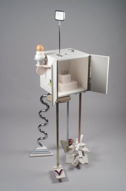 Peter Shire (American, born 1947). <em>"Ode to a Soapstone Monkey" Cabinet-on-Stand</em>, 1988. SURREL (TM) solid surfacing material, Colorcore (TM), metal, porcelain, fluorescent bulb, Overall: 69 7/8 x 31 1/2 x 30 in. (177.5 x 80 x 76.2 cm). Brooklyn Museum, Gift of Formica Corporation, 1991.6.1a-d. Creative Commons-BY (Photo: Brooklyn Museum, 1991.6.1a-d_open.jpg)