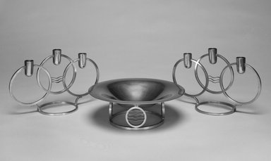 Walter Dorwin Teague (American, 1883–1960). <em>Candelabrum, One of Pair, "Classique Modern,"</em> Introduced 1934. Pewter, 6 9/16 x 10 1/8 x 4 5/16 in.  (16.7 x 25.7 x 11.0 cm). Brooklyn Museum, Marie Bernice Bitzer Fund, 1993.78.3. Creative Commons-BY (Photo: , 1992.102_1993.78.3_1993.78.4_bw.jpg)