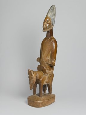 Yorùbá. <em>Figure of Shango on Horseback</em>, early 20th century. Wood, pigment, 40 x 14 1/2 x 9 in. (101.6 x 36.8 x 22.9 cm). Brooklyn Museum, Gift of Corice and Armand P. Arman, 1992.133.4. Creative Commons-BY (Photo: Brooklyn Museum, 1992.133.4_threequarter_PS1.jpg)