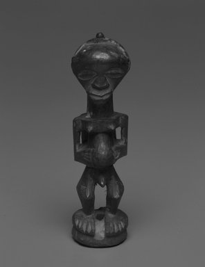 Songye. <em>Standing Male Figure</em>, early 20th century. Wood, metal, 5 x 1 3/4 in. (13.0 x 4.5 cm). Brooklyn Museum, Gift of Drs. Noble and Jean Endicott, 1992.136.15. Creative Commons-BY (Photo: Brooklyn Museum, 1992.136.15_bw.jpg)