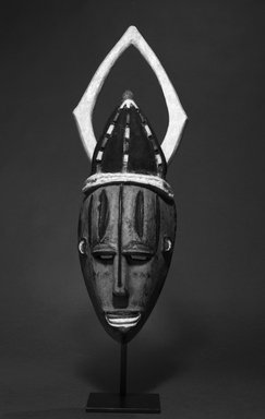 Urhobo. <em>Mask</em>, 20th century. Wood, pigment, beads, 19 3/4 x 6 x 4 3/4 in. (50.2 x 15.2 x 12.1 cm). Brooklyn Museum, Gift of Lee Lorenz, 1992.138.1. Creative Commons-BY (Photo: Brooklyn Museum, 1992.138.1_bw.jpg)