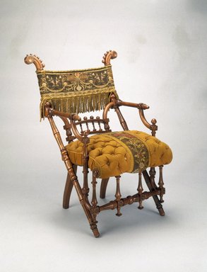 George Jacob Hunzinger (American, born Germany, 1835–1898). <em>Armchair</em>, designed: 1869; patented: March 30, 1869. Wood, original upholstery, 35 5/8 x 27 1/4 x 25 1/2 in.  (90.5 x 69.2 x 64.8 cm). Brooklyn Museum, H. Randolph Lever Fund, 1992.208. Creative Commons-BY (Photo: Brooklyn Museum, 1992.208_IMLS_SL2.jpg)