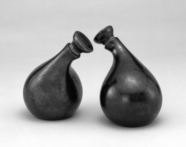 Eva Zeisel (American, born Hungary, 1906–2011). <em>Cruet and Stopper, "Town and Country" Pattern</em>, ca. 1942–1943. Earthenware, cork, 5 1/4 × 4 × 4 5/8 in. (13.3 × 10.2 × 11.7 cm). Brooklyn Museum, Gift of Paul F. Walter
, 1992.98.9a-b. Creative Commons-BY (Photo: , 1992.98.9a-b_1992.98.10a-b_bw.jpg)