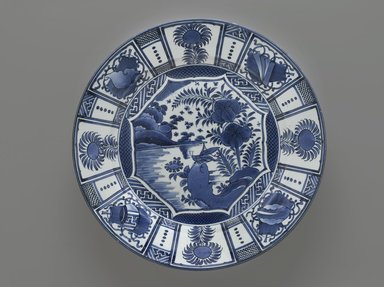  <em>Arita Blue and White Charger</em>, ca. 1680. Porcelain, blue underglaze, in Wan Li style, 3 x 18 1/8 in. (7.6 x 46 cm). Brooklyn Museum, Gift of Dr. Bertram H. Schaffner, 1993.106.10. Creative Commons-BY (Photo: Brooklyn Museum, 1993.106.10_PS2.jpg)