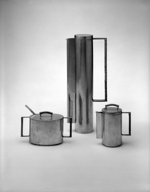 Michael Jerry (American, 20th century). <em>Coffeepot with Lid, from 4-Piece Coffee Set</em>, ca. 1959. Pewter, cane, 12 3/16 x 5 1/4 x 2 7/16 in. (31.0 x 13.3 x 6.2 cm). Brooklyn Museum, Modernism Benefit Fund, 1993.158.1a-b. Creative Commons-BY (Photo: Brooklyn Museum, 1993.158.1a-b_bw_SL1.jpg)