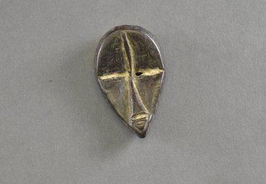 Dan. <em>Personal Miniature Mask</em>, 20th century. Wood, 2 3/4 x 1 5/8in. (7 x 4.1cm). Brooklyn Museum, Gift of Dr. Svend E. Holsoe, 1993.175.10. Creative Commons-BY (Photo: Brooklyn Museum, 1993.175.10_front_PS5.jpg)