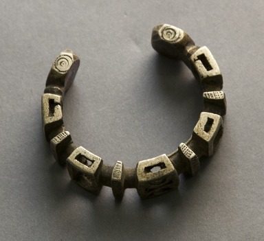 Nupe. <em>Bracelet</em>, 19th or 20th century. White metal alloy, 2 3/8 × 2 5/8 in. (6 × 6.7 cm). Brooklyn Museum, Gift of Mr. and Mrs. Arnold Syrop, 1993.183.3. Creative Commons-BY (Photo: Brooklyn Museum, 1993.183.3_front_PS10.jpg)