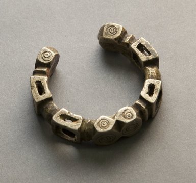 Nupe. <em>Bracelet</em>, 19th or 20th century. White metal alloy, 2 5/8 x 2 3/4 in. Brooklyn Museum, Gift of Mr. and Mrs. Arnold Syrop, 1993.183.4. Creative Commons-BY (Photo: Brooklyn Museum, 1993.183.4_front_PS10.jpg)