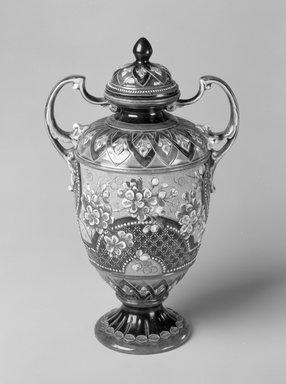 Doulton Pottery (1815-present). <em>Vase with lid, model 7756</em>, 1891-1902. Glazed earthenware, 11 3/4 x 7 7/8 x 5 in.  (29.8 x 20 x 12.7 cm). Brooklyn Museum, Gift of Paul F. Walter, 1994.119.9a-b. Creative Commons-BY (Photo: Brooklyn Museum, 1994.119.9a-b_bw.jpg)