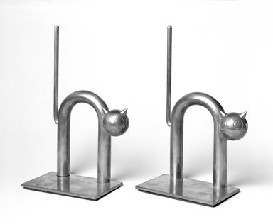 Walter von Nessen (American, born Germany, 1889-1943). <em>Cat Bookend, One of Pair</em>, 1930-1935. Copper-plated alloy, 7 3/8 x 4 1/2 x 2 1/2 in. (18.7 x 11.4 x 6.4 cm). Brooklyn Museum, H. Randolph Lever Fund, 1994.156.4. Creative Commons-BY (Photo: , 1994.156.4_1994.156.5_bw.jpg)