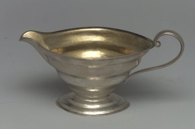 Reed & Barton (American, 1840-present). <em>Creamer, Modernist Patter, Part of a 4-Piece Set</em>, 1928-1929. Silver, 2 7/8 x 5 3/4 x 3 in. (7.3 x 14.6 x 7.6 cm). Brooklyn Museum, Gift of Daniel Morris and Denis Gallion, 1994.205.13. Creative Commons-BY (Photo: Brooklyn Museum, 1994.205.13.jpg)