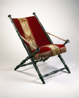 P.J. Hardy (American, 19th century). <em>Folding Chair</em>, Patented 1867. Ebonized wood, metal, original upholstery, 36 x 25 3/4 x 32 1/4 in.  (91.4 x 65.4 x 81.9 cm). Brooklyn Museum, Gift of Norman Mizuno and Alan J. Davidson, 1995.110. Creative Commons-BY (Photo: Brooklyn Museum, 1995.110_IMLS_SL2.jpg)