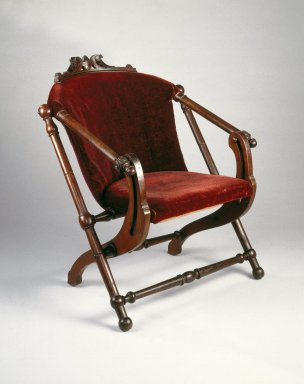 George Jacob Hunzinger (American, born Germany, 1835-1898). <em>Folding Chair</em>, ca. 1873. Wood, original upholstery, 31 5/8 x 27 1/2 x 29 1/4 in.  (80.3 x 69.9 x 74.3 cm). Brooklyn Museum, Gift of Norman K. Mizuno and Alan J. Davidson, 1995.153. Creative Commons-BY (Photo: Brooklyn Museum, 1995.153_IMLS_SL2.jpg)