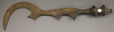 Ngala. <em>Single Edge Knife with Curved Blade</em>, 19th century. Iron, wood, copper alloy, 29 1/4 x 7 1/4 x 3 1/4 in. Brooklyn Museum, Gift of Allen C. Davis, 1995.171.6. Creative Commons-BY (Photo: Brooklyn Museum, 1995.171.6_PS10.jpg)