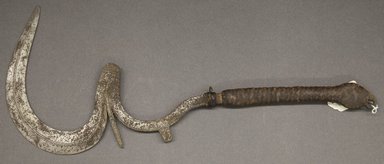 Possibly Bornu. <em>Throwing Knife</em>, 19th century. Iron, leather, 22 x 8 3/4 in. Brooklyn Museum, Gift of Drs. Noble and Jean Endicott, 1995.173.6. Creative Commons-BY (Photo: Brooklyn Museum, 1995.173.6_PS10.jpg)