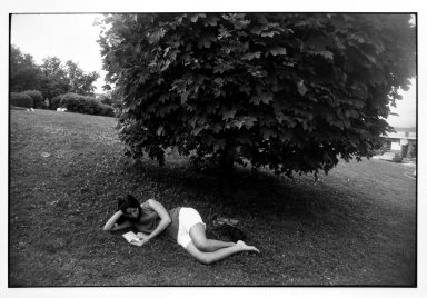 Garry Winogrand (American, 1928-1984). <em>Untitled (Woman Reading Under a Treee), from Women are Beautiful Series</em>. Gelatin silver photograph, sheet: 11 x 14 in. (27.9 x 35.5 cm). Brooklyn Museum, Gift of Mitchell F. Deutsch, 1995.206.14. © artist or artist's estate (Photo: Brooklyn Museum, 1995.206.14_bw.jpg)
