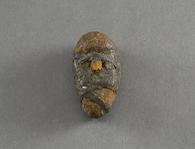 Possibly Dan. <em>Personal Miniature Mask</em>, 20th century. Terracotta, string, organic matter, 2 3/4 x 1 1/2in. (7 x 3.8cm). Brooklyn Museum, Gift of Blake Robinson, 1995.7.17. Creative Commons-BY (Photo: Brooklyn Museum, 1995.7.17_front_PS5.jpg)
