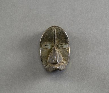 Dan. <em>Personal Miniature Mask</em>, 20th century. Wood, metal, 3 x 1 3/4 x 1 5/8in. (7.6 x 4.4 x 4.1cm). Brooklyn Museum, Gift of Blake Robinson, 1995.7.25. Creative Commons-BY (Photo: Brooklyn Museum, 1995.7.25_front_PS5.jpg)