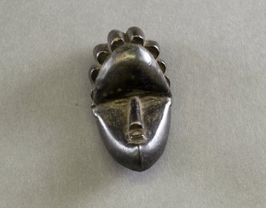 Bassa. <em>Personal Miniature Mask</em>, 20th century. Wood, 3 1/4 x 1 1/2 x 1 1/2 in. (8.3 x 3.8 x 3.8 cm). Brooklyn Museum, Gift of Blake Robinson, 1995.7.26. Creative Commons-BY (Photo: Brooklyn Museum, 1995.7.26_front_PS5.jpg)