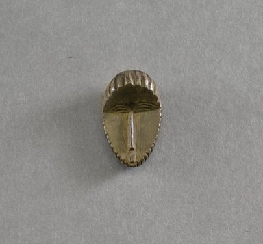 Bassa. <em>Personal Miniature Mask</em>, 20th century. Wood, 1 3/4 x 1 x 3/4in. (4.4 x 2.5 x 1.9cm). Brooklyn Museum, Gift of Blake Robinson, 1995.7.30. Creative Commons-BY (Photo: Brooklyn Museum, 1995.7.30_front_PS5.jpg)