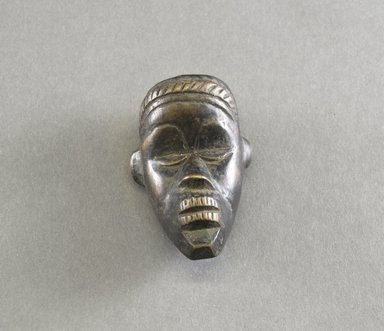 Dan. <em>Personal Miniature Mask</em>, 20th century. Wood, 3 1/4 x 2 x 1 1/4in. (8.3 x 5.1 x 3.2cm). Brooklyn Museum, Gift of Blake Robinson, 1995.7.51. Creative Commons-BY (Photo: Brooklyn Museum, 1995.7.51_front_PS5.jpg)