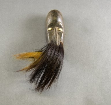 Mano. <em>Personal Miniature Mask</em>, 20th century. Wood, ivory or bone, 4 7/8 x 2 5/8in. (12.4 x 6.7cm). Brooklyn Museum, Gift of Blake Robinson, 1995.7.6. Creative Commons-BY (Photo: Brooklyn Museum, 1995.7.6_front_PS5.jpg)