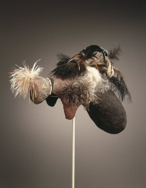 Karamojong. <em>Mudpack Coiffure (Emedot)</em>, 20th century. Organic material, pigment, human hair, plastic beads, ostrich feathers, chicken feathers, 12 1/2 x 12 1/2 x 19 3/4 in. (31.8 x 31.8 x 50.1 cm). Brooklyn Museum, John W. James Fund, 1996.112.2. Creative Commons-BY (Photo: Brooklyn Museum, 1996.112.2_SL1.jpg)