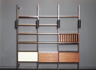 George Nelson (American, 1908-1986). <em>Comprehensive Storage Unit (Storage and Shelving System)</em>, 1966-1968. Walnut, metal, fabric, glass, white laminate, 102 x 97 x 18 1/2 in. (264.4 x 264.2 x 47.0 cm). Brooklyn Museum, Gift of Myrna Greenberg Ladin and Leonard I. Ladin, 1996.182.1. Creative Commons-BY (Photo: Brooklyn Museum, 1996.182.1_transp656.jpg)