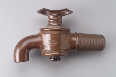 Charles Graham Chemical Pottery Works (1878–ca. 1913). <em>Bib Faucet</em>, late 19th century. Glazed stoneware, 9 1/2 x 16 1/2 x 5 1/2 in. (24.0 x 42.0 x 14.0 cm). Brooklyn Museum, Gift of Emma and Jay Lewis, 1996.8. Creative Commons-BY (Photo: Brooklyn Museum, 1996.8.jpg)