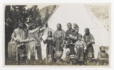 Unknown. <em>[Untitled] (Two Chiefs, Three Women, and Five Children in front of a Teepee)</em>, ca. 1900. Gelatin silver print, 5 1/4 x 3 1/8 in. (13.3 x 8.0 cm). Brooklyn Museum, Gift of Sasha Nyary and Family, 1997.163.16 (Photo: Brooklyn Museum, 1997.163.16_PS2.jpg)