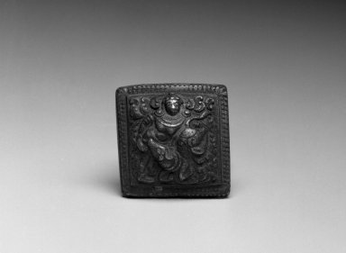  <em>Weight with Image of a Hindu Divinity</em>, 14th-15th century. Cast bronze, 1 3/4 x 1 5/8 in.  (4.4 x 4.1 cm). Brooklyn Museum, Gift of Georgia and Michael de Havenon, 1998.178.2. Creative Commons-BY (Photo: Brooklyn Museum, 1998.178.2_bw.jpg)
