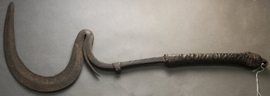 Matakam. <em>Throwing Knife</em>, early 20th century. Iron, leather, 23 x 8 3/4 x 1 in.  (58.4 x 22.2 x 2.5 cm). Brooklyn Museum, Gift of Mark S. Rapoport, M.D. and Jane C. Hughes, 1999.133.11. Creative Commons-BY (Photo: Brooklyn Museum, 1999.133.11_side_PS10.jpg)
