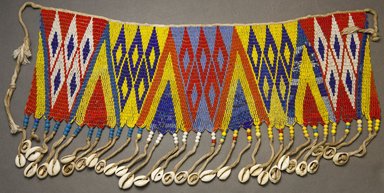 Kirdi. <em>Beaded Apron</em>, early 20th century. Colored glass beads, cotton, shells, 5 5/8 x 17 in. (14.3 x 43.2 cm). Brooklyn Museum, Gift of Mark S. Rapoport, M.D. and Jane C. Hughes, 1999.133.2. Creative Commons-BY (Photo: Brooklyn Museum, 1999.133.2_front_PS10.jpg)