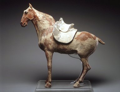  <em>Figure of a Horse with Saddle</em>, late 6th century. Earthenware, traces of pigment, 19 1/2 x 22 x 5 1/2 in. (49.5 x 56.0 x 14.0 cm). Brooklyn Museum, Gift of Peter W. Scheinman, 1999.138a-b. Creative Commons-BY (Photo: Brooklyn Museum, 1999.138a-b_transp4807.jpg)