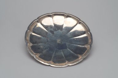 Tiffany & Company (American, founded 1853). <em>Footed Serving Plate</em>, ca. 1915. Silver, 1 3/16 x 10 3/16 x 10 3/16 in. (3 x 25.9 x 25.9 cm). Brooklyn Museum, Gift in memory of Harry and Marian R. Lipton presented on behalf of their great-grandchildren, Elissa H. Samet, Brandon R. Derringer, Jeremy A. Derringer, and Justin M. Derringer, 2000.6.3. Creative Commons-BY (Photo: Brooklyn Museum, 2000.6.3.jpg)