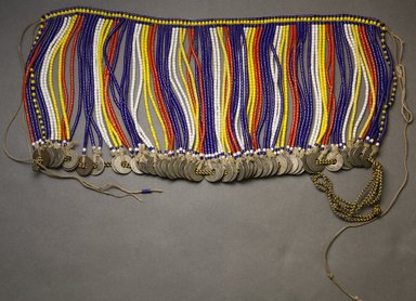 Kirdi. <em>Pubic Apron</em>, mid-20th century. Glass beads, copper alloy, cotton, 7 x 14 1/2 in.  (17.8 x 36.8 cm). Brooklyn Museum, Gift of Mark S. Rapoport, M.D. and Jane C. Hughes, 2000.69.15. Creative Commons-BY (Photo: Brooklyn Museum, 2000.69.15_front_PS10.jpg)