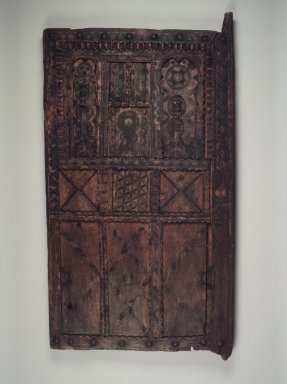  <em>Granary Door</em>, early 20th century. Wood, pigment, 62 1/2 x 33 1/4 x 3 3/4 in. (158.8 x 84.5 x 9.5 cm). Brooklyn Museum, Gift of Dr. Charles S. Grippi in memory of Professor Virgil H. Bird, 2001.82. Creative Commons-BY (Photo: Brooklyn Museum, 2001.82_transp5391.jpg)