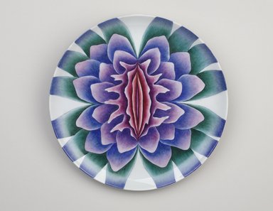 Judy Chicago (American, born 1939). <em>Sappho Place Setting</em>, 1974–1979. Runner:Cotton/linen base fabric, woven interface support material (horsehair, wool, and linen), cotton twill tape, silk, synthetic gold cord, padded silk satin fabric, silk thread
Plate: Porcelain with overglaze enamel (China paint), Runner:51 1/4 x 29 3/4 in. (130.2 x 75.6 cm). Brooklyn Museum, Gift of The Elizabeth A. Sackler Foundation, 2002.10-PS-10. © artist or artist's estate (Photo: Brooklyn Museum, 2002.10-PS-10_plate_PS9.jpg)